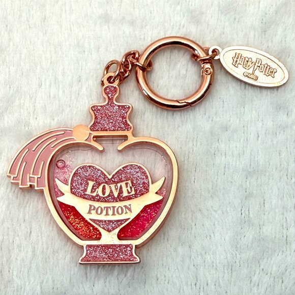 Harry Potter Love Potion 2.5" Metal Keychain w/Liquid Glitter Back - Picture 1 of 6